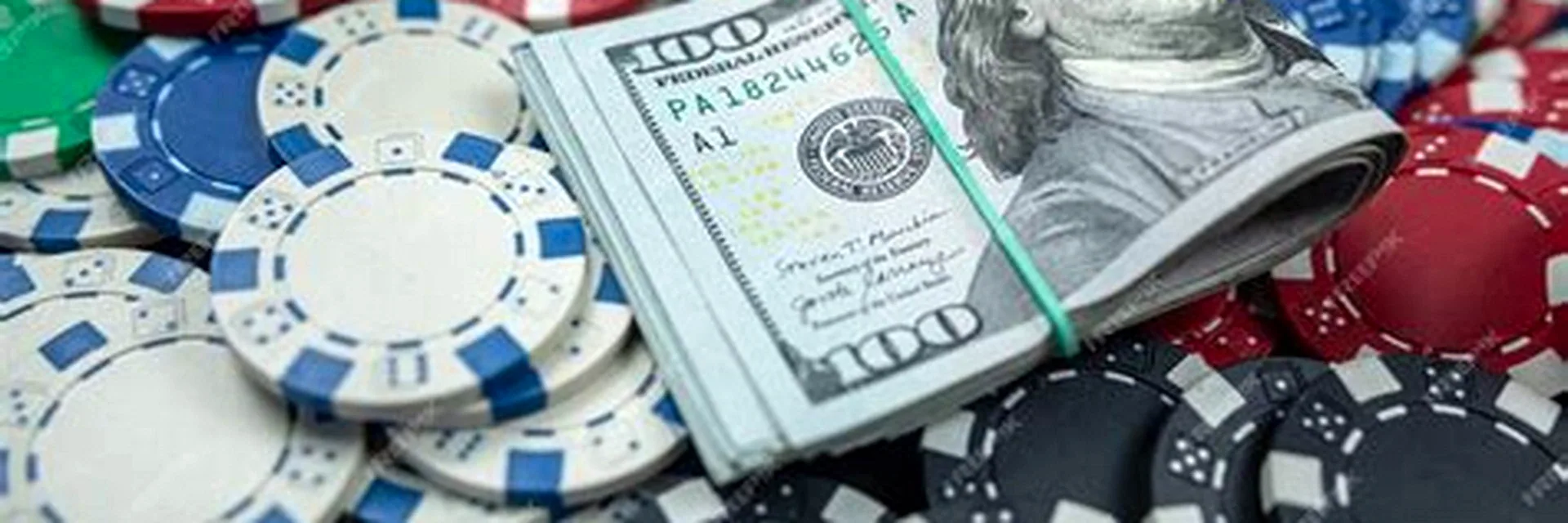 Calypso Casino cash out represented by dollar bills and casino chips at the cashier